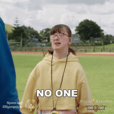 A Girl Wearing Glasses And A Yellow Sweatshirt Says No One GIF