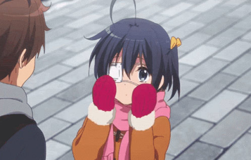 A Girl Wearing Gloves And A Scarf Is Looking At A Boy GIF