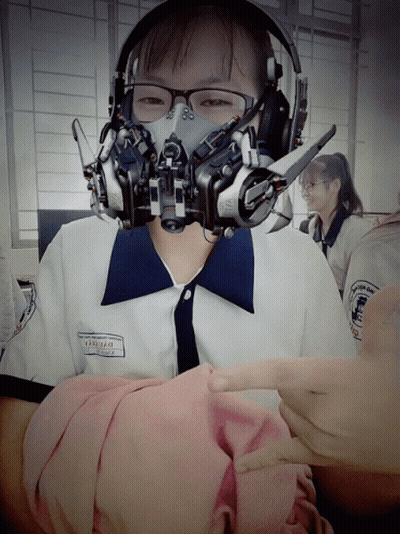 A Girl Wearing Headphones And A Gas Mask Has The Name Thanh Thao On Her Shirt GIF
