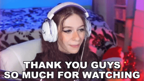 A Girl Wearing Headphones Is Sitting In A Chair And Saying Thank You Guys So Much For Watching . GIF
