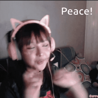 A Girl Wearing Headphones With Cat Ears And The Words Peace GIF