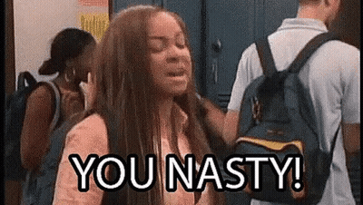 A Girl With A Backpack Is Standing In A Locker Room With A Man Standing Behind Her . GIF