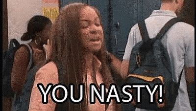 A Girl With A Backpack Is Standing In A Locker Room With A Man Standing Behind Her . GIF