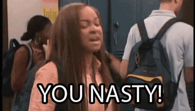 A Girl With A Backpack Is Standing In Front Of A Group Of People And Says `` You Nasty '' . GIF