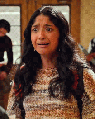 A Girl With A Backpack Making A Funny Face GIF