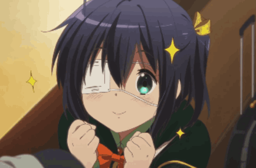 A Girl With A Bandage On Her Eye And A Yellow Star On Her Head GIF