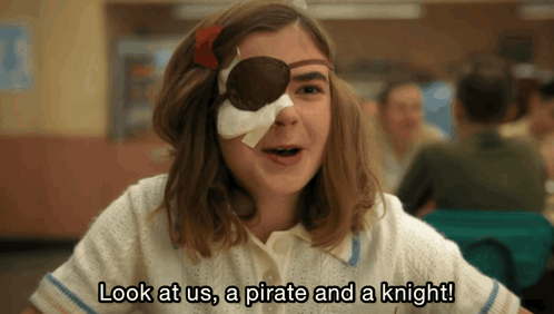 A Girl With A Bandage On Her Eye And The Words Look At Us A Pirate And A Knight GIF