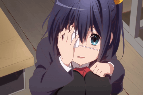 A Girl With A Bandage On Her Eye Is Covering Her Face With Her Hands GIF