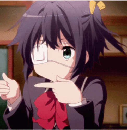 A Girl With A Bandage On Her Eye Is Pointing GIF