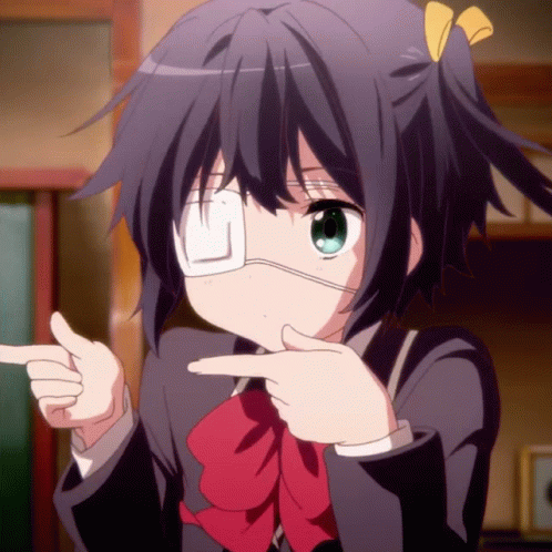A Girl With A Bandage On Her Eye Points At Something GIF