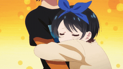 A Girl With A Blue Bow In Her Hair Is Being Hugged By A Man GIF