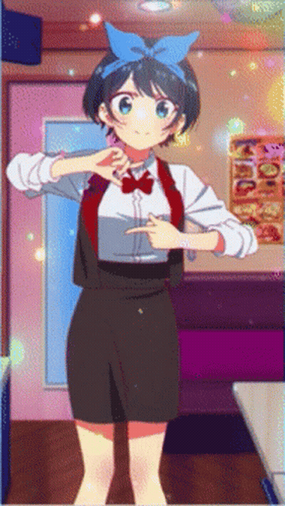 A Girl With A Blue Bow On Her Head Is Pointing GIF