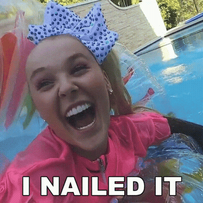 A Girl With A Bow On Her Head Is Laughing In A Pool With The Words `` I Nailed It '' Below Her . GIF