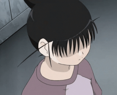 A Girl With A Bun On Her Head Looks Down At Something GIF