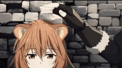 A Girl With A Cat Ear Is Standing In Front Of A Brick Wall Holding A Sword . GIF