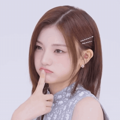 A Girl With A Dior Shirt On Is Making A Face GIF