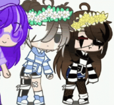 A Girl With A Flower Crown On Her Head Is Standing Next To Two Other Girls . GIF