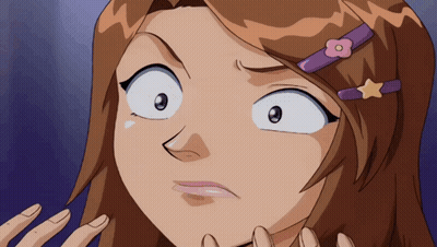 A Girl With A Flower In Her Hair Is Making A Face GIF