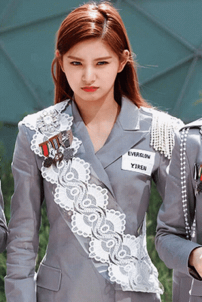 A Girl With A Name Tag That Says Everglow GIF