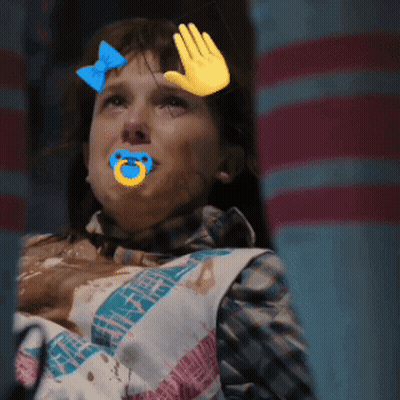 A Girl With A Pacifier In Her Mouth And A Hand On Her Face GIF