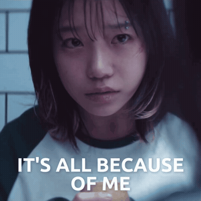 A Girl With A Piercing On Her Forehead Looks At The Camera With The Words It 'S All Because Of Me Below Her GIF