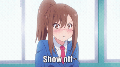 A Girl With A Ponytail And A Blue Suit Says Show Off GIF