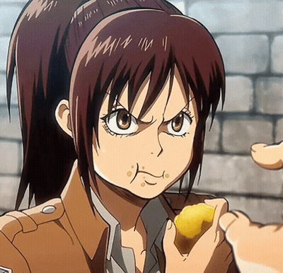 A Girl With A Ponytail Is Eating A Piece Of Food From A Person 'S Hand GIF