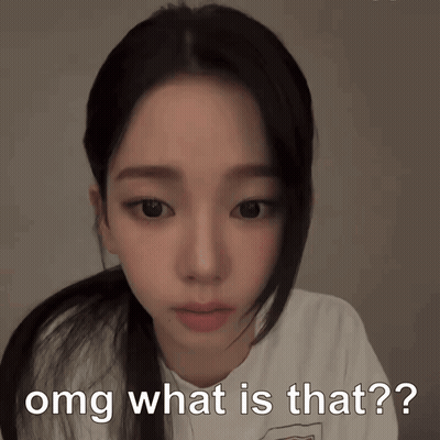 A Girl With A Ponytail Looks At The Camera With The Words " Omg What Is That " Written Below Her GIF