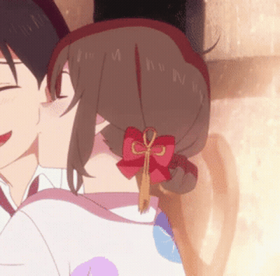A Girl With A Red Bow In Her Hair Kisses A Boy GIF
