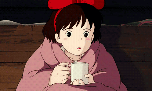 Girl With Red Bow Holding Mug GIF