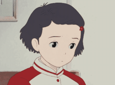 A Girl With A Red Flower In Her Hair Is Sitting In A Chair GIF