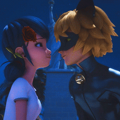 A Girl With A Rose In Her Hair Is Looking At A Man In A Cat Suit GIF