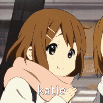A Girl With A Scarf Around Her Neck Has Katie Written On Her Face GIF