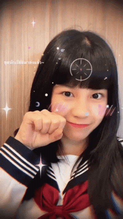 A Girl With A Target On Her Head Is Wearing A Sailor Suit GIF