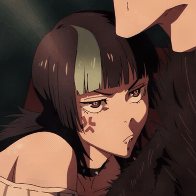 A Girl With A Tattoo Of An Angry Face GIF