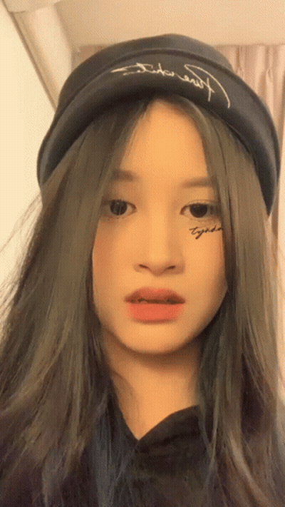 A Girl With A Tattoo On Her Face Has The Word Together On It GIF