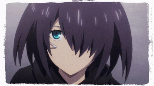 A Girl With Black Hair And Blue Eyes Looks At The Camera GIF