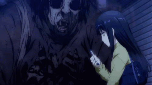 A Girl With Black Hair And Green Eyes Is Looking At Her Phone GIF