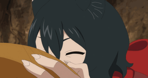 A Girl With Black Hair Is Licking A Piece Of Food With Her Tongue Out GIF