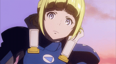 A Girl With Blonde Hair And Blue Eyes Is Wearing A Blue And Yellow Outfit With A White Triangle On The Chest GIF