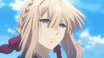 A Girl With Blonde Hair And Blue Eyes Looks At The Camera GIF
