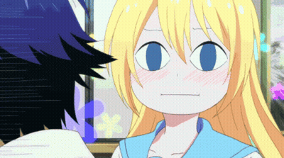 A Girl With Blonde Hair And Blue Eyes Making A Face GIF