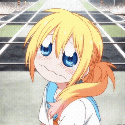 A Girl With Blonde Hair And Blue Eyes Making A Funny Face GIF