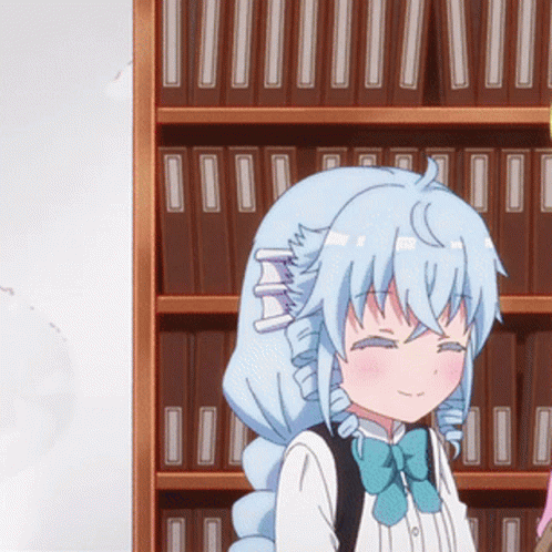 A Girl With Blue Hair And A Blue Bow Tie Stands In Front Of A Bookshelf GIF