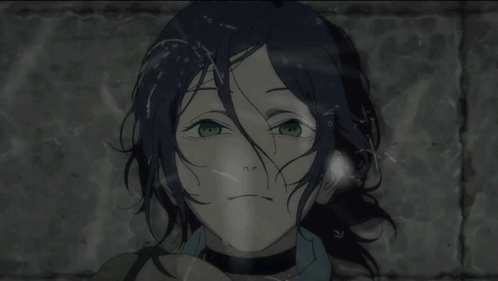 A Girl With Blue Hair And Green Eyes Looks At The Camera GIF
