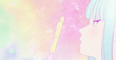 A Girl With Blue Hair Is Holding A Feather In Her Hand And Looking At It . GIF