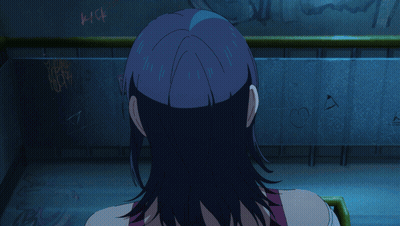 A Girl With Blue Hair Is Screaming In Front Of A Wall That Has Graffiti On It GIF