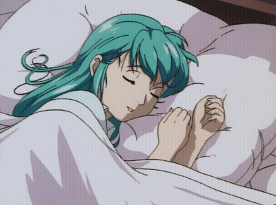 A Girl With Blue Hair Is Sleeping In A Bed With Her Eyes Closed GIF