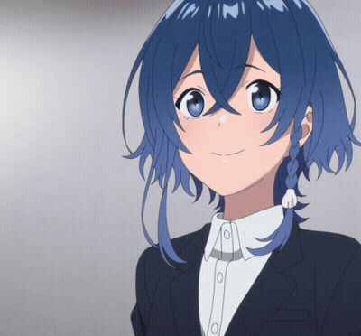 A Girl With Blue Hair Is Smiling And Wearing A Suit GIF