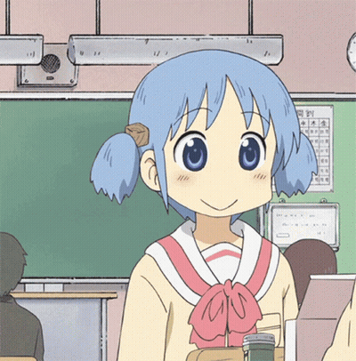 A Girl With Blue Hair Is Smiling In A Classroom With A Calendar On The Wall Behind Her GIF